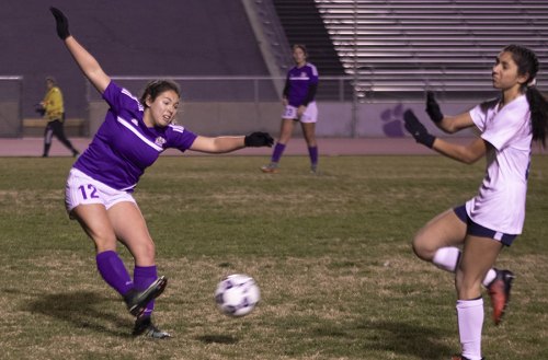 Lemoore's varsity girls' soccer team had its hands full with Redwood High School Thursday night in Tiger Stadium. Pictured is Reilly Nava, getting in a kick in the 9-1 loss to the Rangers.